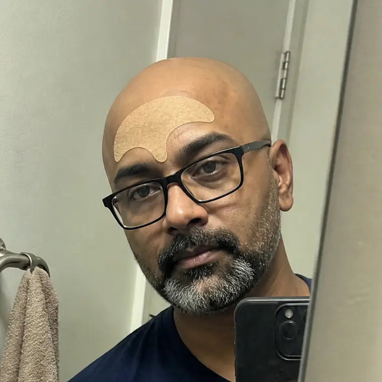Femi, taking a mirror selfie