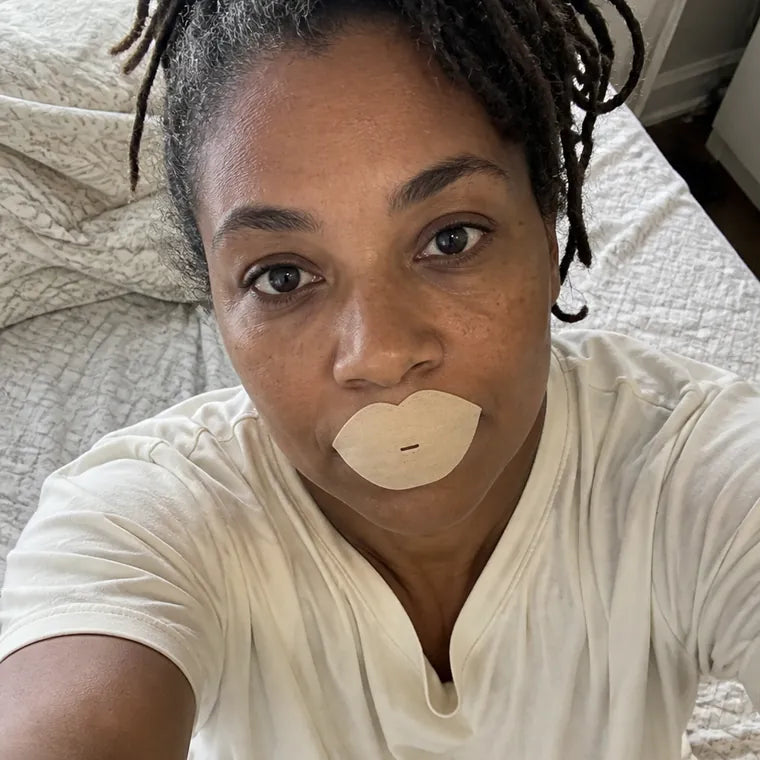Dionne, sitting up in bed