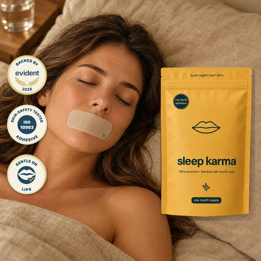 Woman asleep wearing Sleep Karma mouth tape, water glass on the nightstand