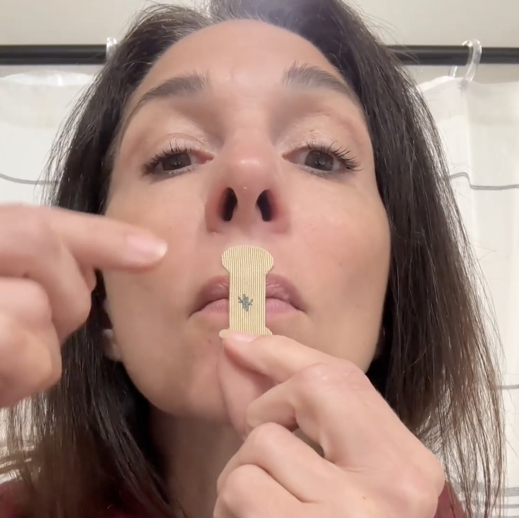 Audrey Spina applying Sleep Karma mouth tape