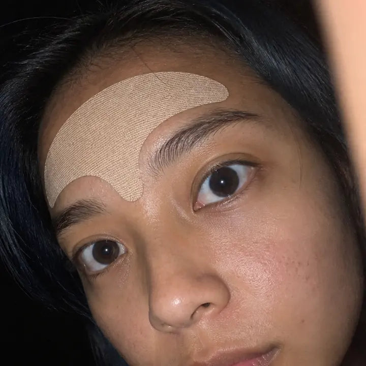 Mei, wearing the wrinkle smoothing forehead tape